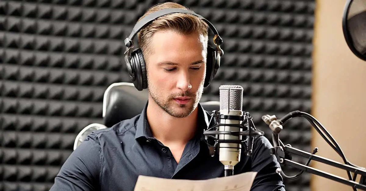 An actor seated with a music stand, script, and microphone in front of them, demonstrating proper microphone positioning and actor placement during an ADR recording session.