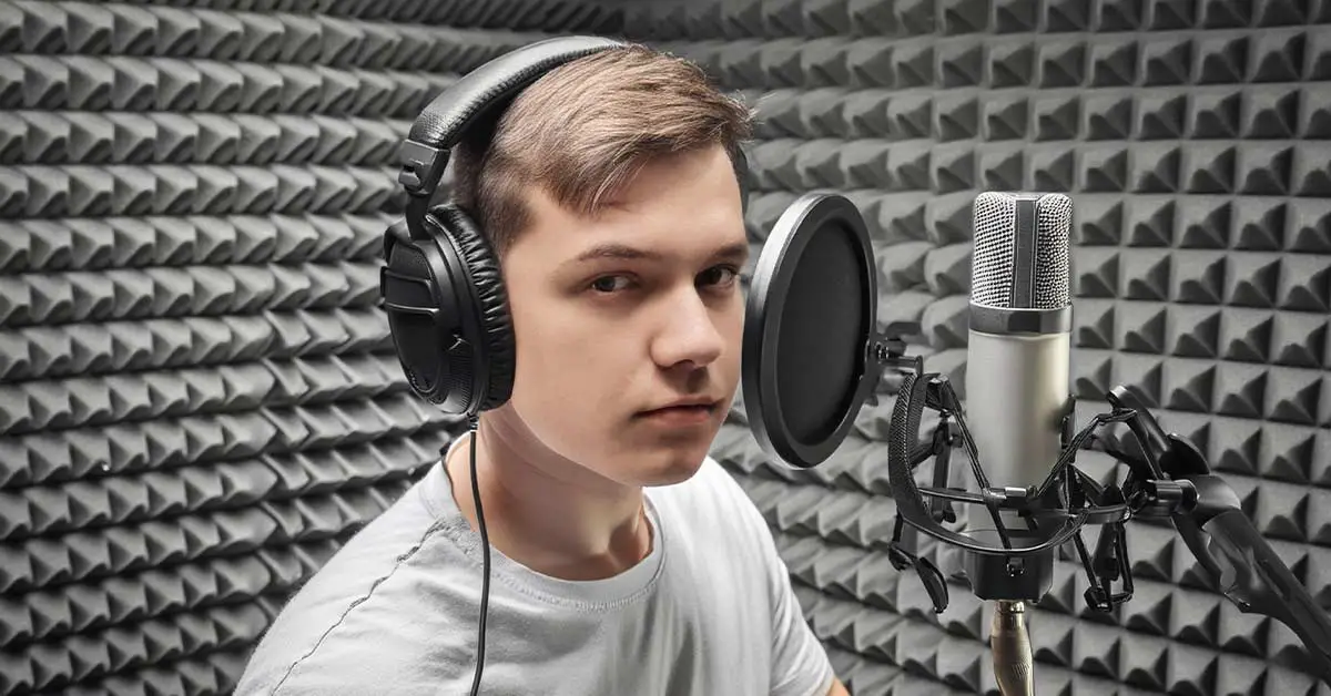 A properly set up ADR recording studio with soundproofing materials on the walls, a microphone stand, pop filter, and an actor positioned as if recording ADR.